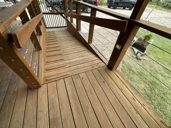 a view of balcony with wooden floor