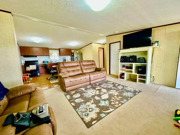 a living room with a couch and a flat screen tv