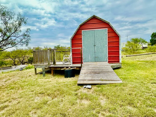 a view of swimming pool with a yard