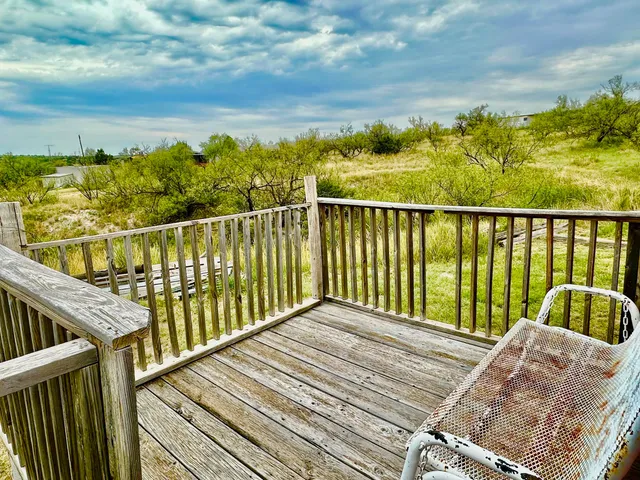 a view of balcony with furniture