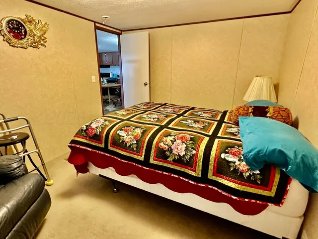 a bedroom with a bed and bathroom