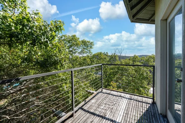 a view of a balcony with wooden floor