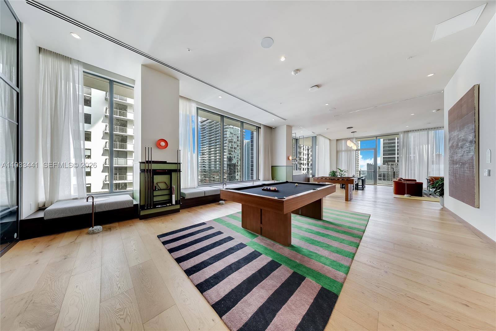 11 Northeast 6th Street, Unit 3209 Miami, FL 33132 - Photo 22 of 27 a living room with furniture and a fireplace