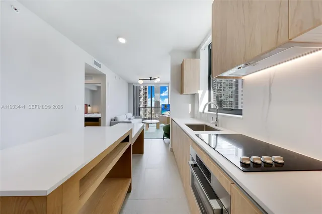 a kitchen with stainless steel appliances granite countertop a sink counter space and cabinets