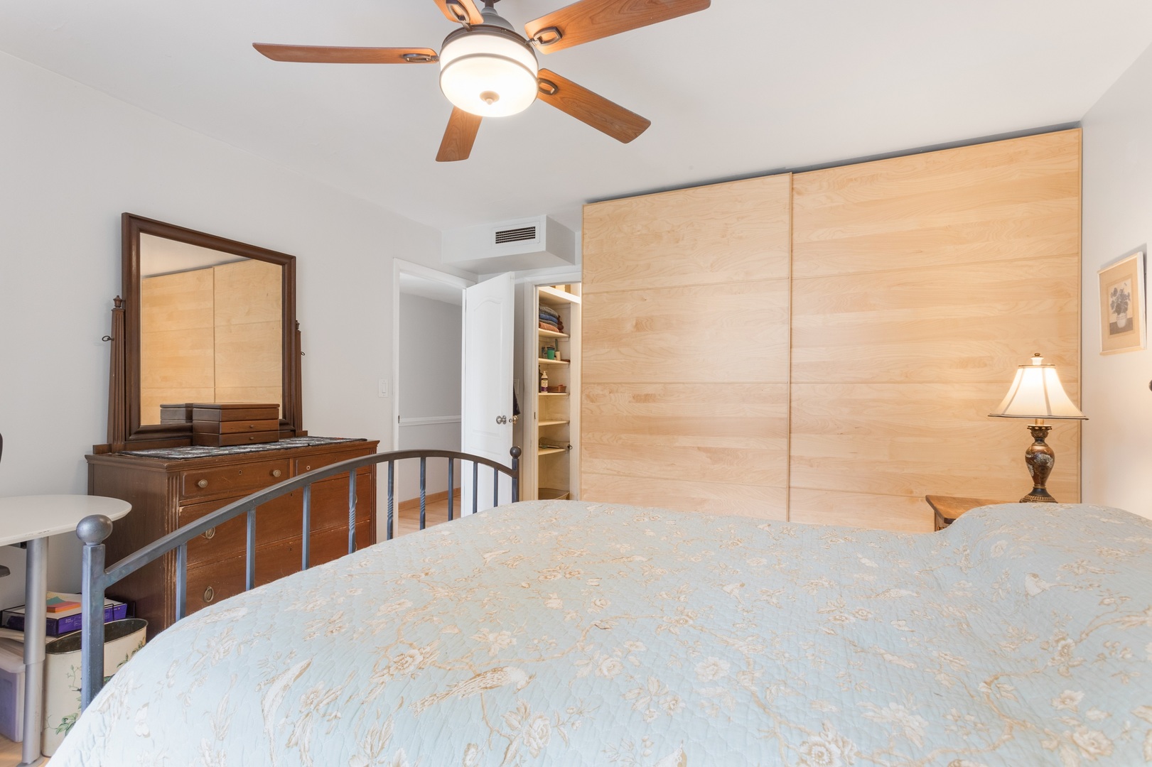 5901 North Sheridan Road, Unit 2K Chicago, IL 60660 - Photo 13 of 27 a bedroom with a large bed and a chandelier