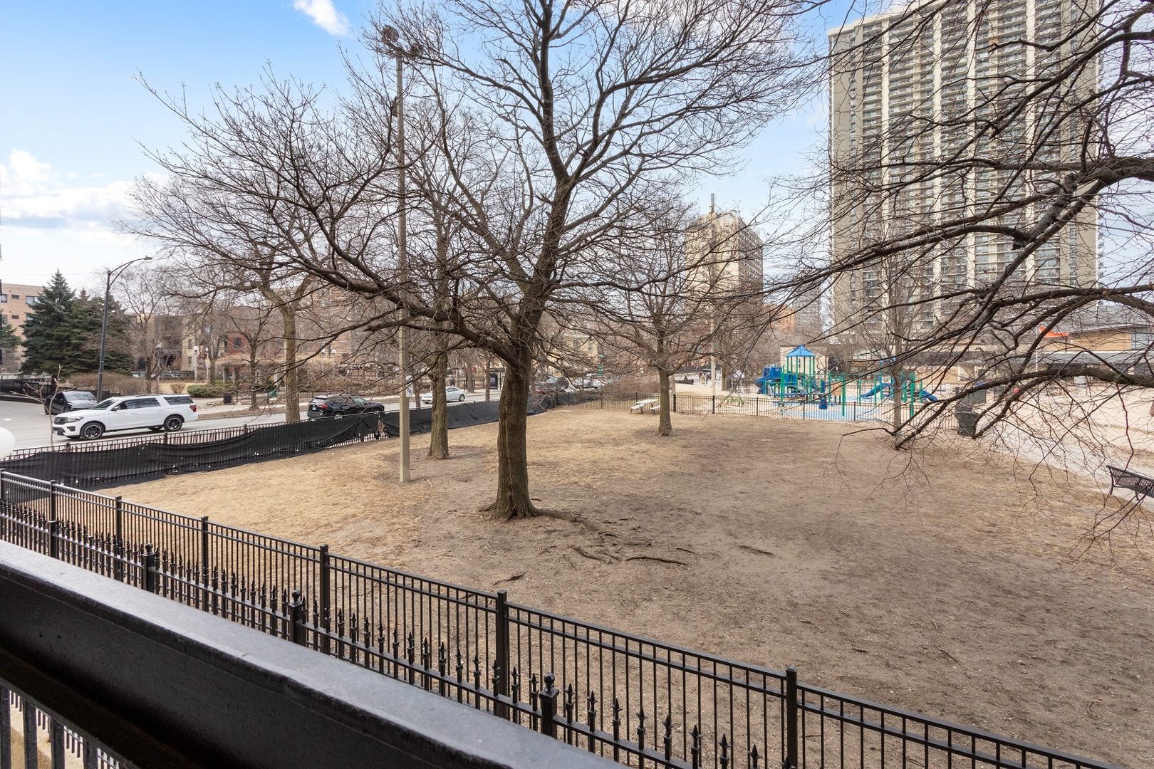 5901 North Sheridan Road, Unit 2K Chicago, IL 60660 - Photo 20 of 27 a view of city street with large trees