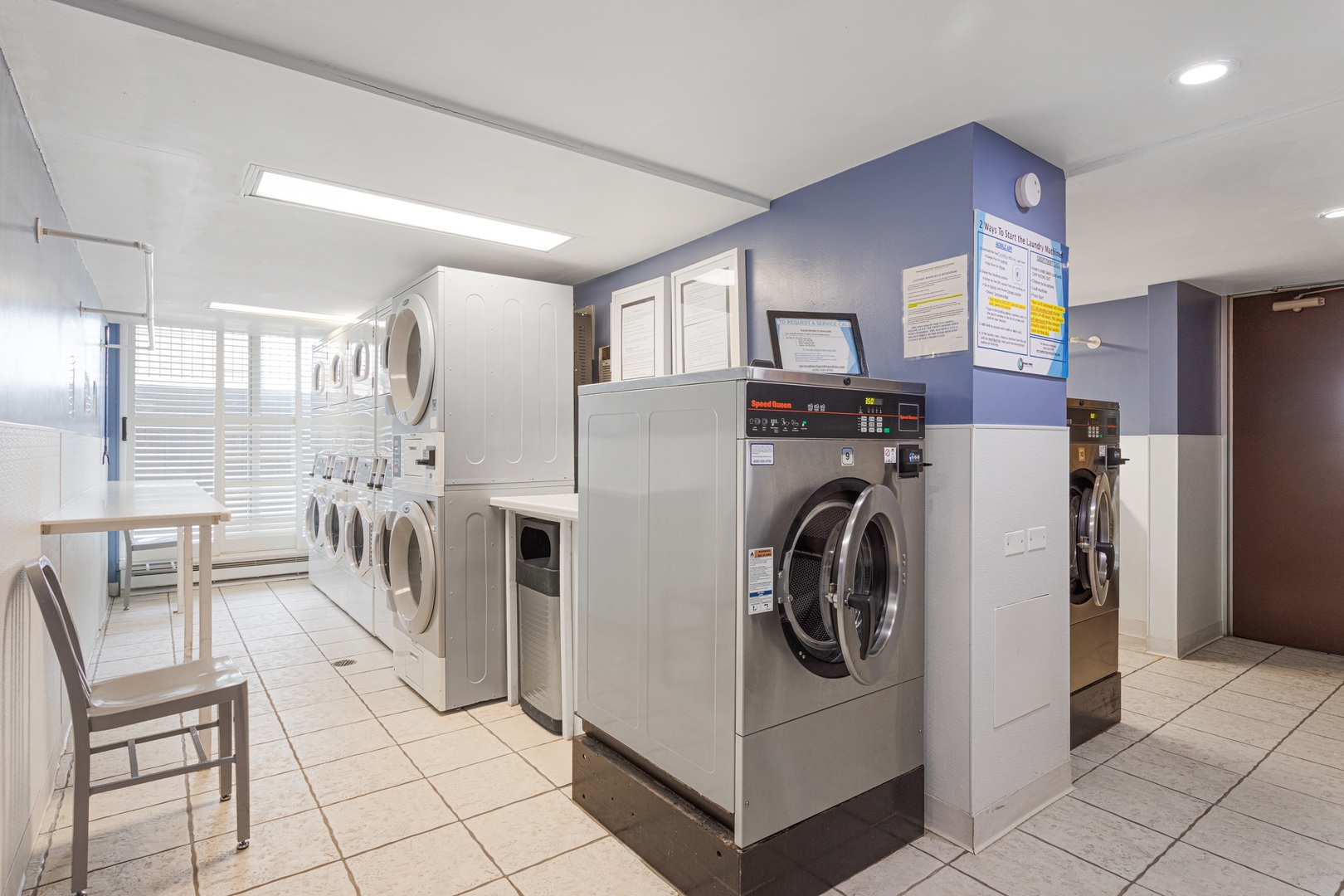 5901 North Sheridan Road, Unit 2K Chicago, IL 60660 - Photo 21 of 27 a kitchen with refrigerator a washer and dryer