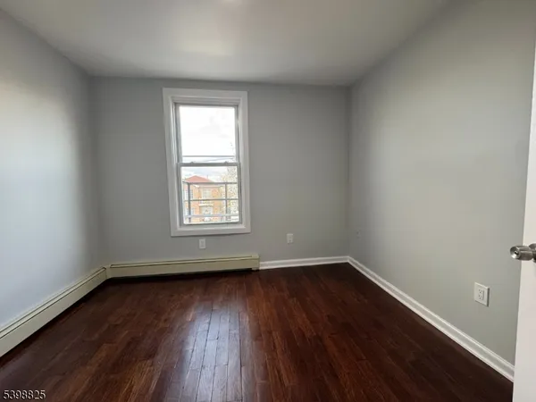 wooden floor and window in an empty room