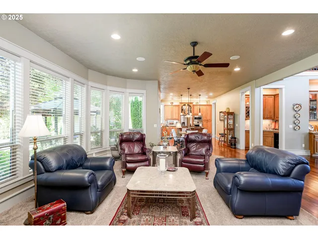 a living room with lots of furniture and a chandelier