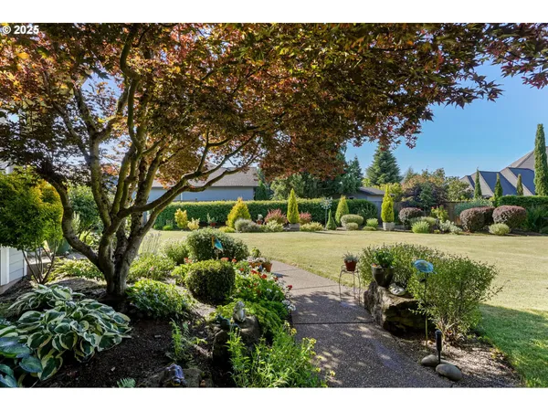 a front view of a house with a garden