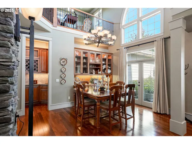 a living room with furniture a flat screen tv and a large window