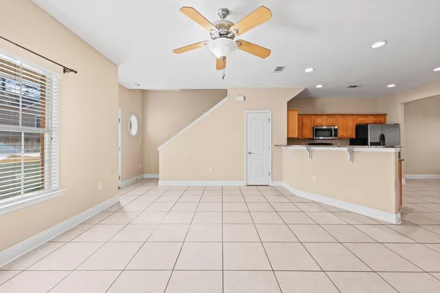 a view of kitchen with furniture and a window
