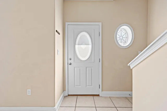 a view of a hallway with a door