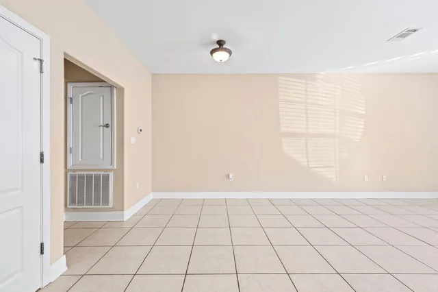 a view of an empty room and window