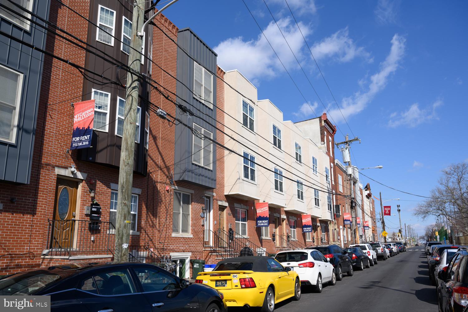 1830 North 16th Street, Unit 2 Philadelphia, PA 19121 - Photo 5 of 19 a city street lined with buildings and cars