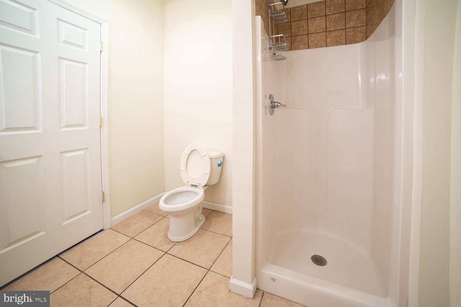 1830 North 16th Street, Unit 2 Philadelphia, PA 19121 - Photo 9 of 19 a bathroom with a toilet and a shower