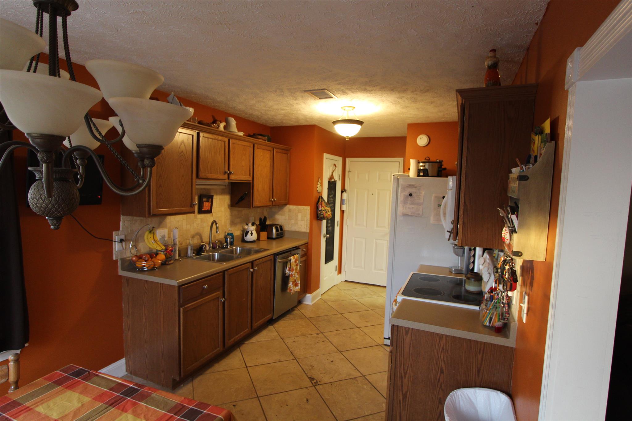 677 Crescent Road Murfreesboro, TN 37128 - Photo 5 of 15 a kitchen with stainless steel appliances granite countertop a stove a refrigerator and a sink