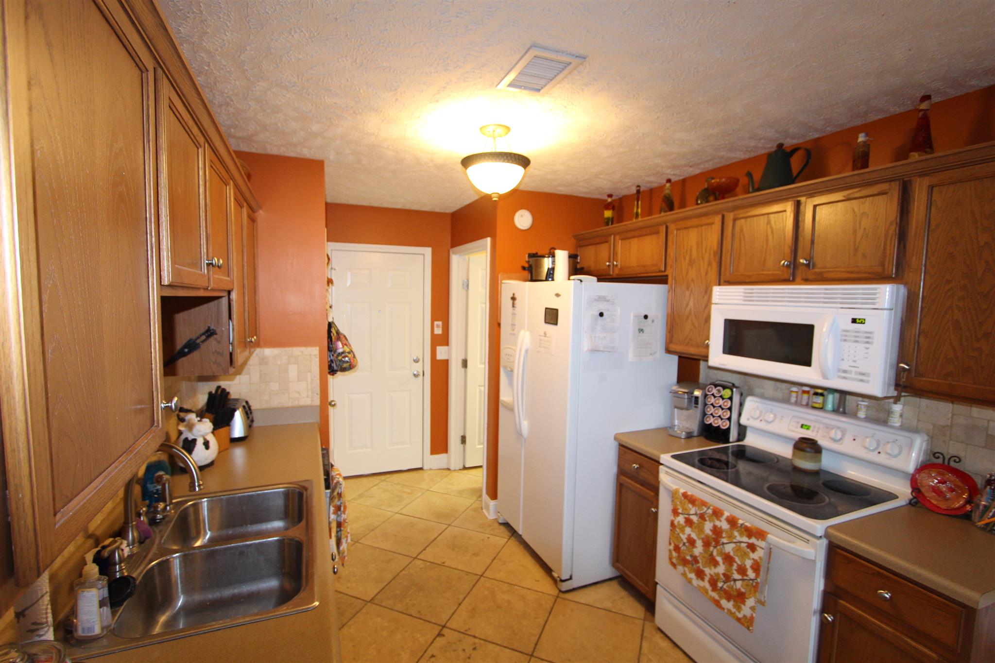 677 Crescent Road Murfreesboro, TN 37128 - Photo 7 of 15 a kitchen with stainless steel appliances a stove a refrigerator and a refrigerator