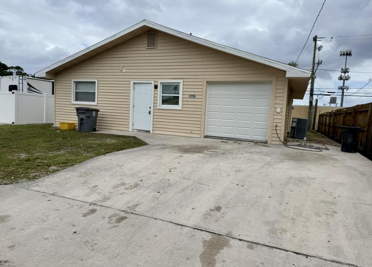 7796 Loomis Street Hypoluxo, FL 33462 - Photo 7 of 7 a view of a house with backyard