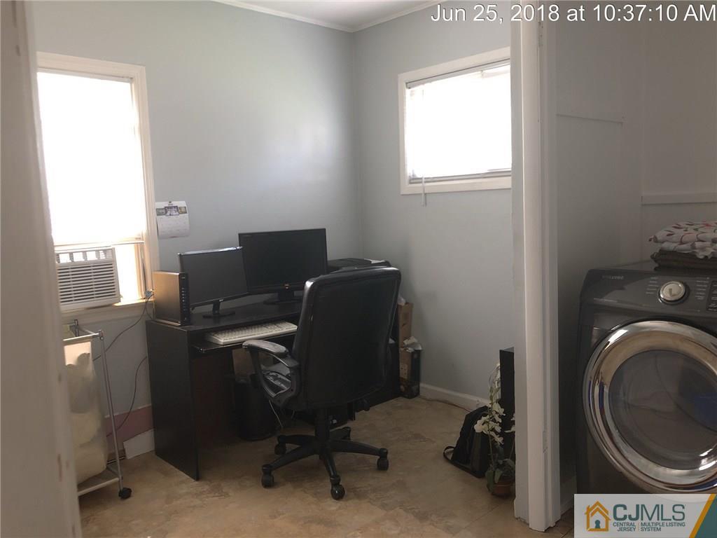 133 Ridge Road Colonia, NJ 07067 - Photo 3 of 5 a view of workspace with washer and dryer