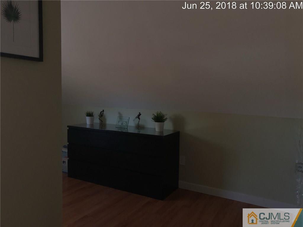 133 Ridge Road Colonia, NJ 07067 - Photo 4 of 5 a room with table and chair