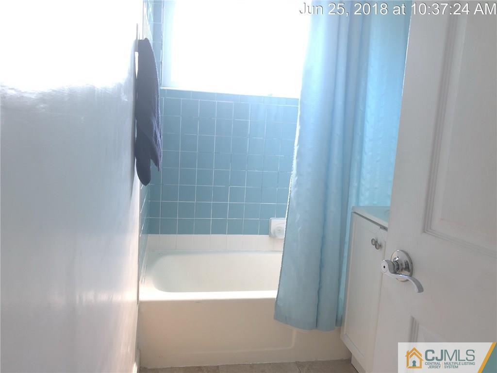 133 Ridge Road Colonia, NJ 07067 - Photo 5 of 5 a bathroom with a bathtub