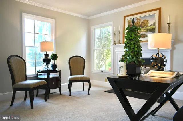 a dining room with furniture and a window