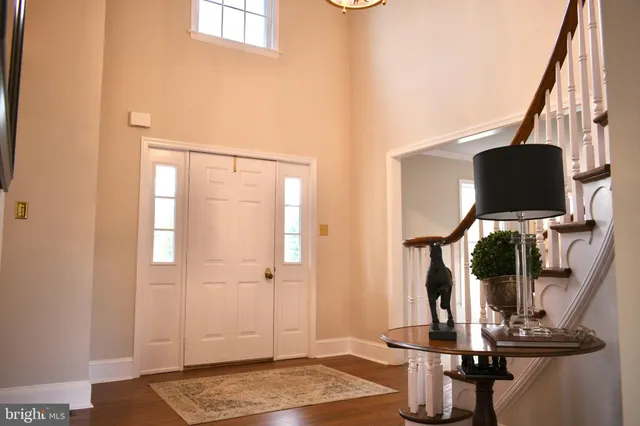 a view of entryway with wooden floor