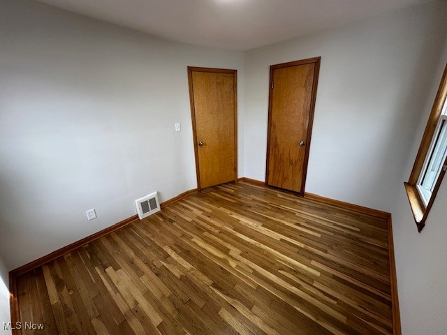 1648 Douglas Road Wickliffe, OH 44092 - Photo 9 of 15 Unfurnished bedroom with wood finished floors and a closet