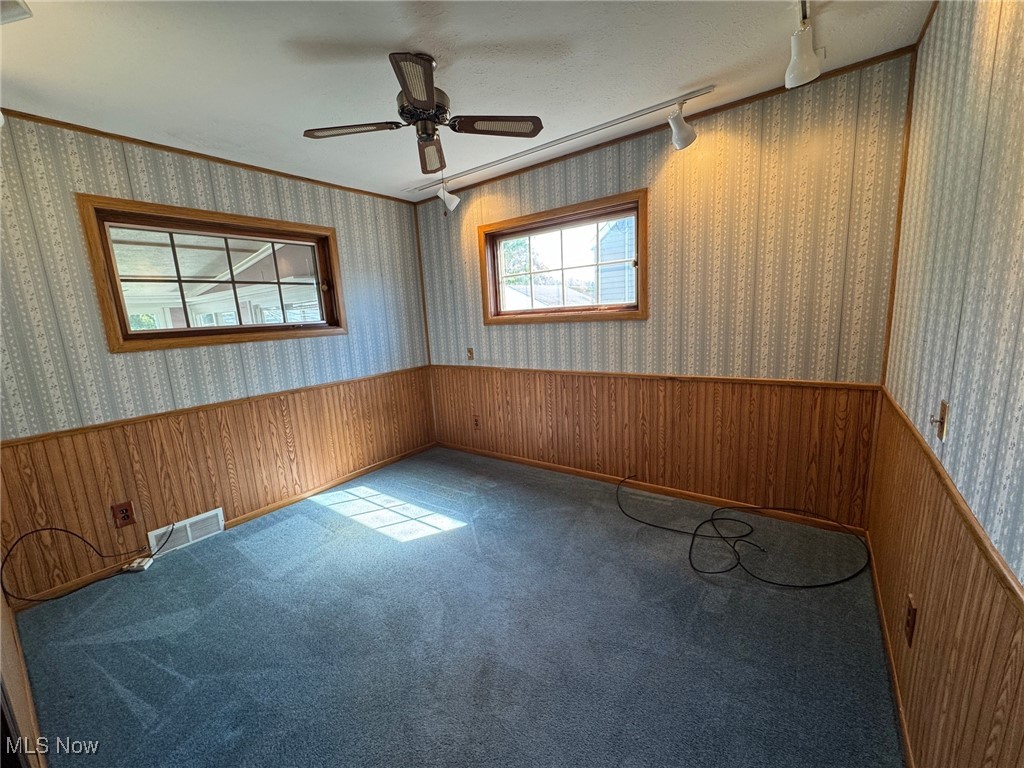 725 Pendley Road Willowick, OH 44095 - Photo 13 of 36 Carpeted bedroom with track lighting, ceiling fan, wainscoting, and crown molding