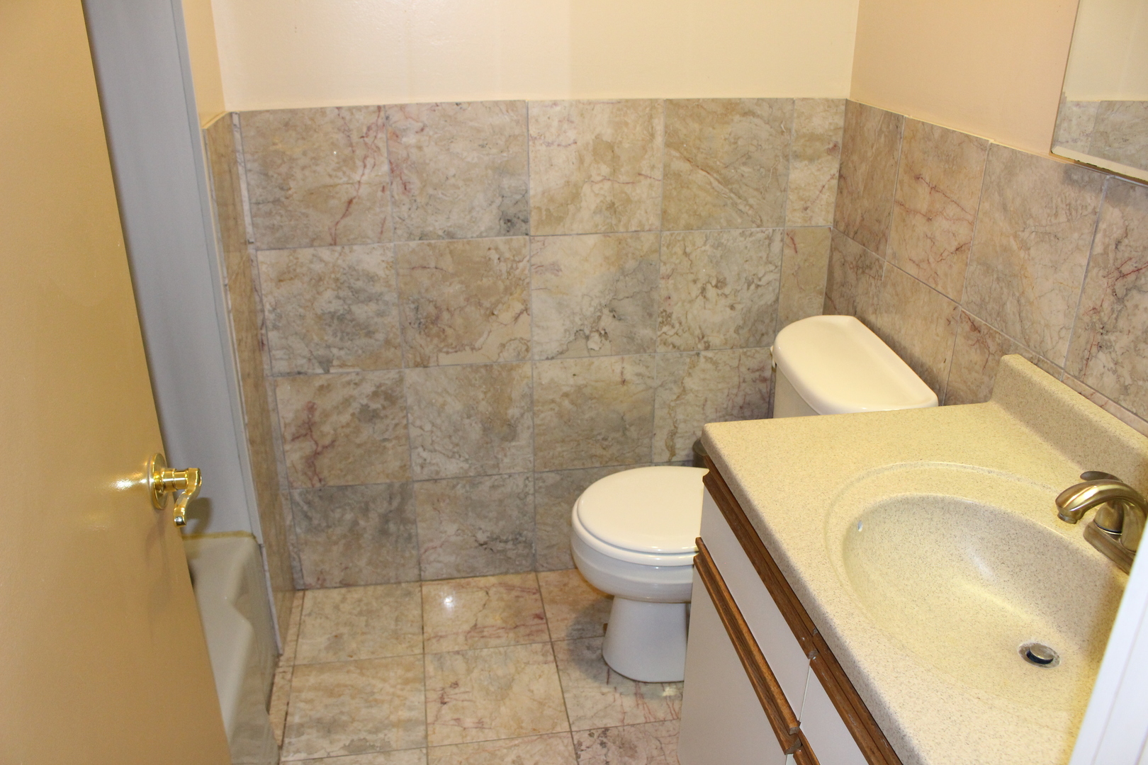 Undisclosed Address Elmhurst, IL 60126 - Photo 14 of 42 a bathroom with a sink and a toilet