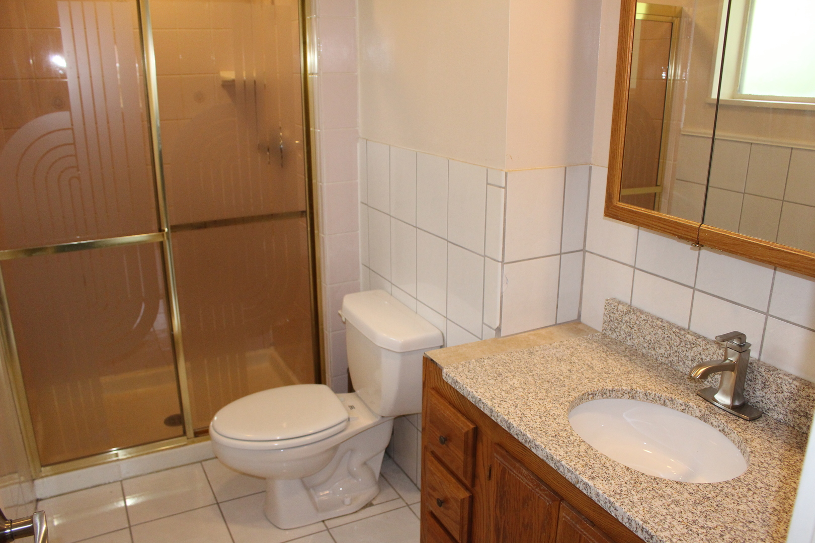 Undisclosed Address Elmhurst, IL 60126 - Photo 15 of 42 a bathroom with a granite countertop sink toilet and shower