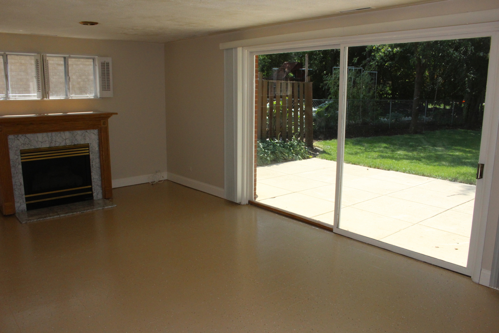 Undisclosed Address Elmhurst, IL 60126 - Photo 16 of 42 a view of empty room with floor to ceiling window and yard