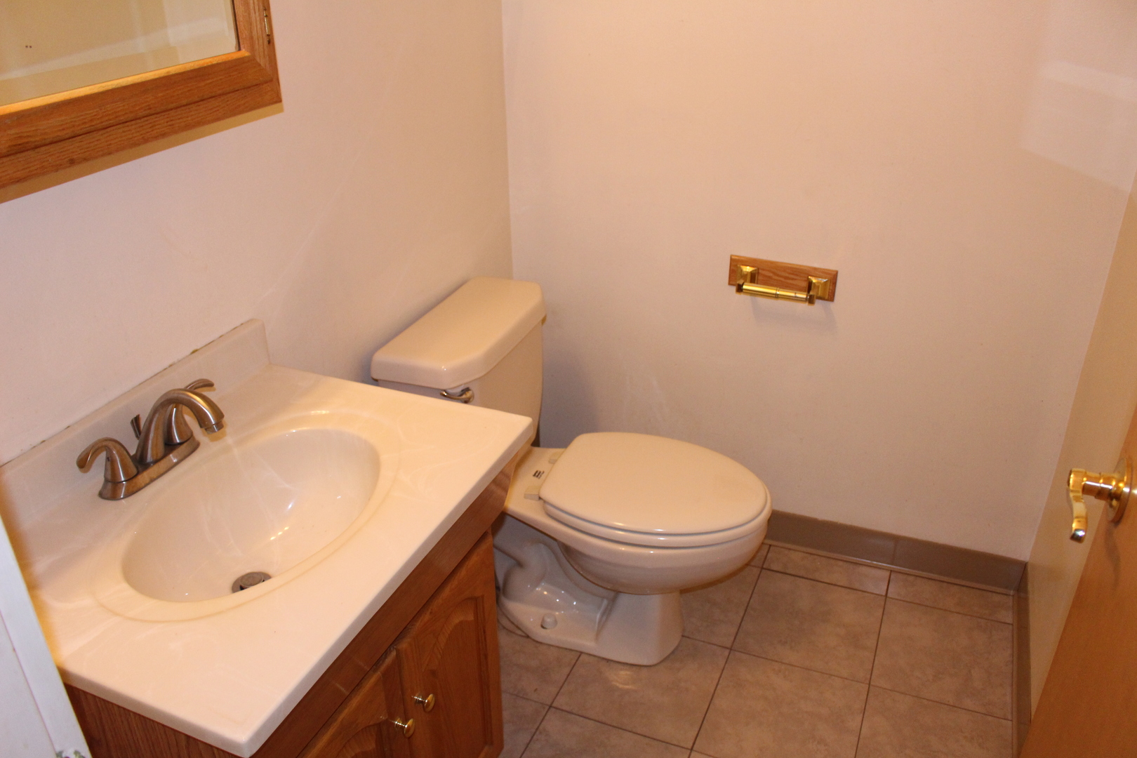 Undisclosed Address Elmhurst, IL 60126 - Photo 17 of 42 a bathroom with a sink and a toilet
