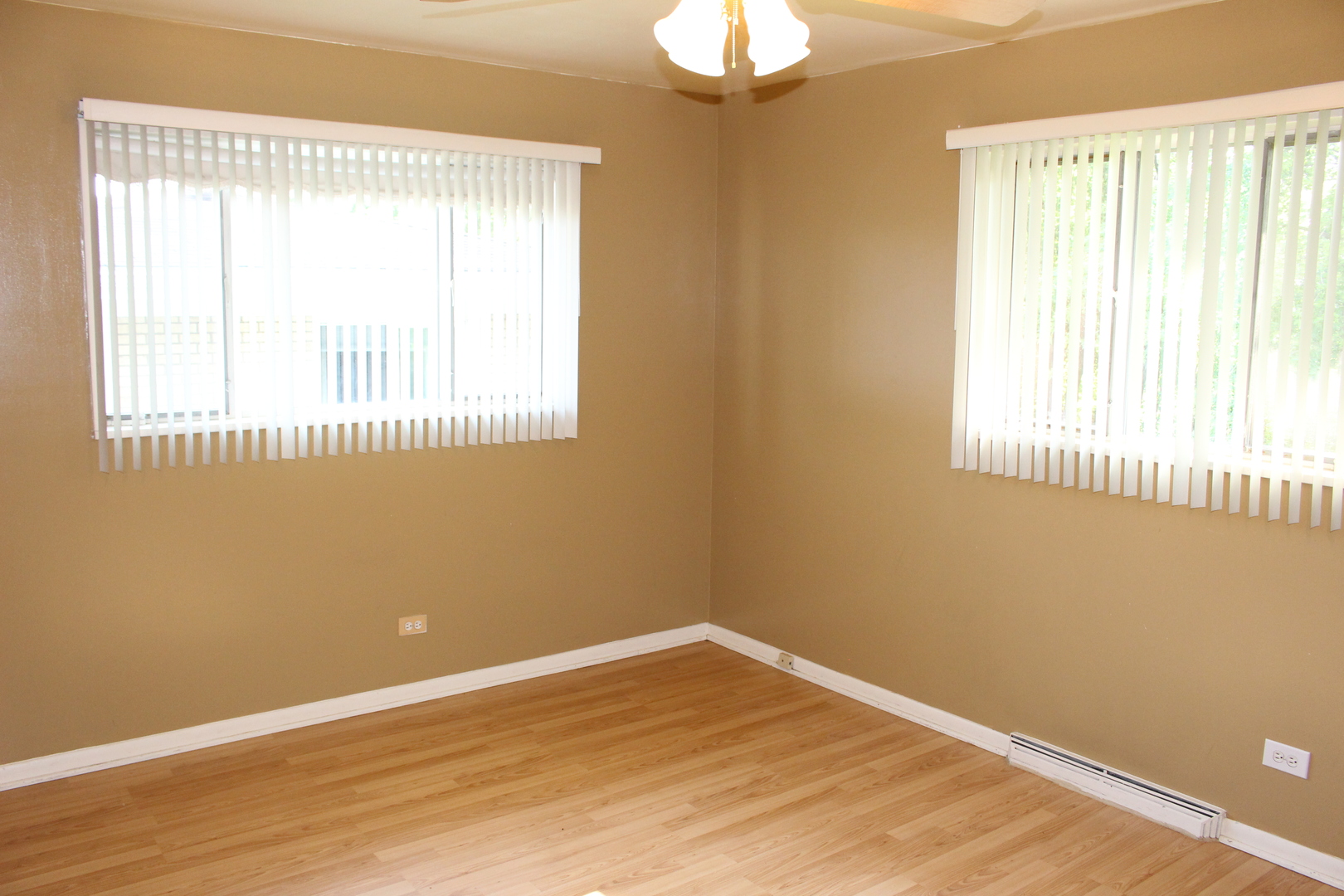 Undisclosed Address Elmhurst, IL 60126 - Photo 18 of 42 an empty room with wooden floor and windows