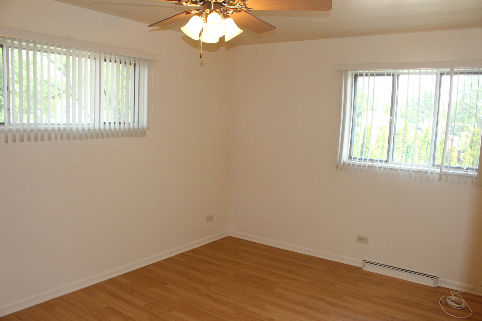 Undisclosed Address Elmhurst, IL 60126 - Photo 19 of 42 an empty room with wooden floor and windows
