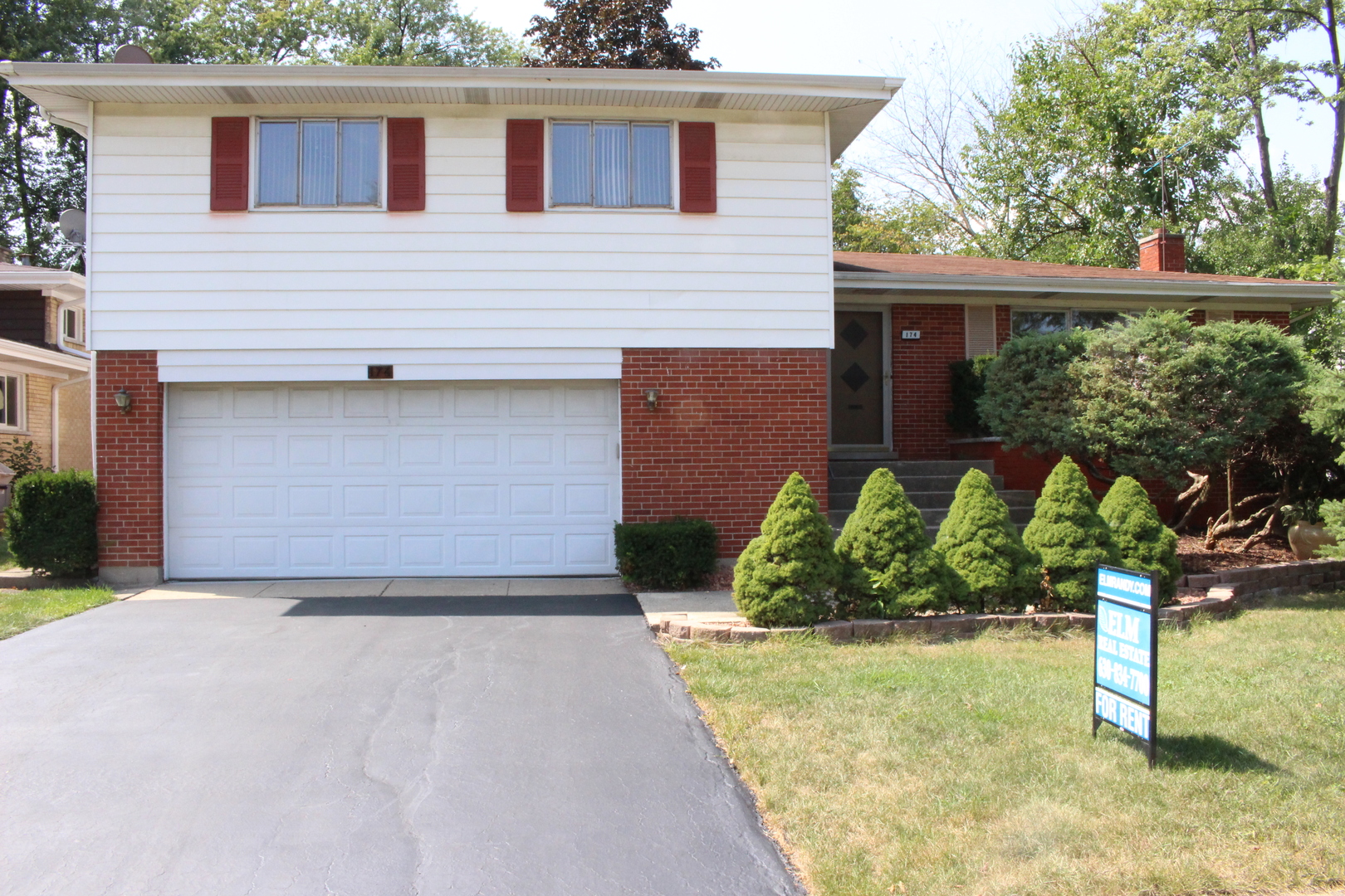 Undisclosed Address Elmhurst, IL 60126 - Photo 2 of 42 a front view of a house with garden