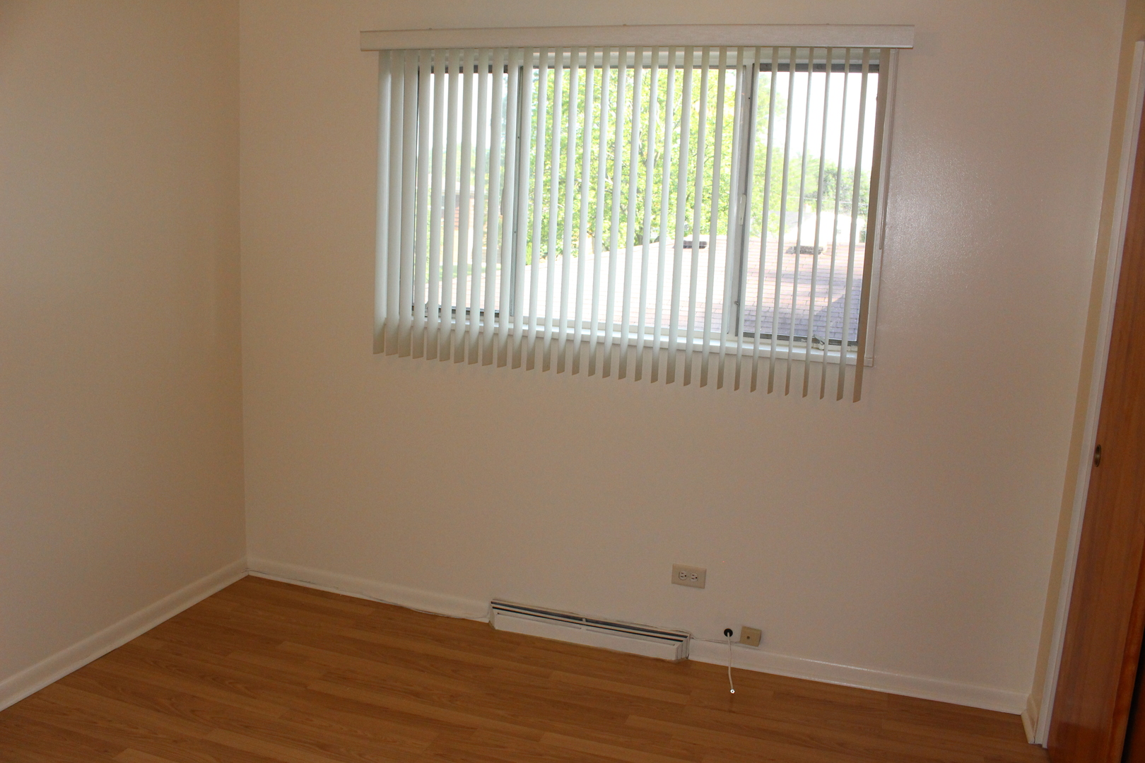 Undisclosed Address Elmhurst, IL 60126 - Photo 21 of 42 an empty room with wooden floor and windows