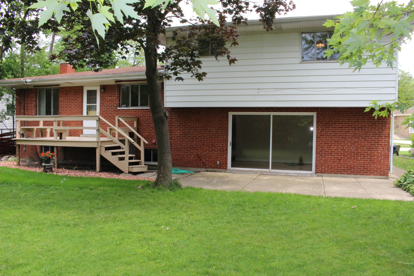 Undisclosed Address Elmhurst, IL 60126 - Photo 30 of 42 a view of a house with a yard and sitting area