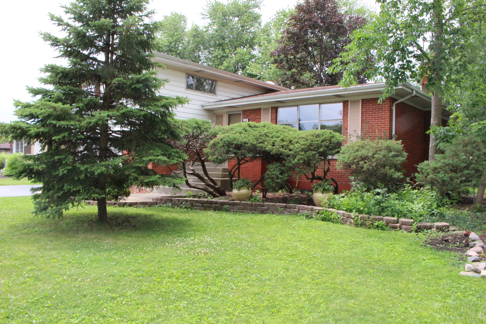 Undisclosed Address Elmhurst, IL 60126 - Photo 3 of 42 a view of a house with a yard and sitting area