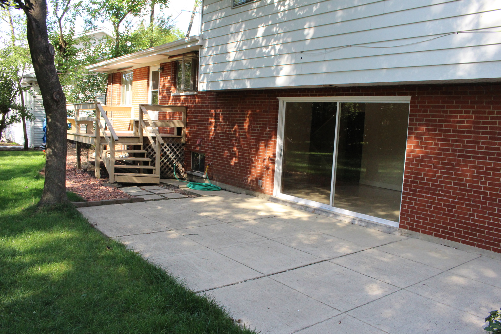 Undisclosed Address Elmhurst, IL 60126 - Photo 33 of 42 a backyard of a house with barbeque oven and trees