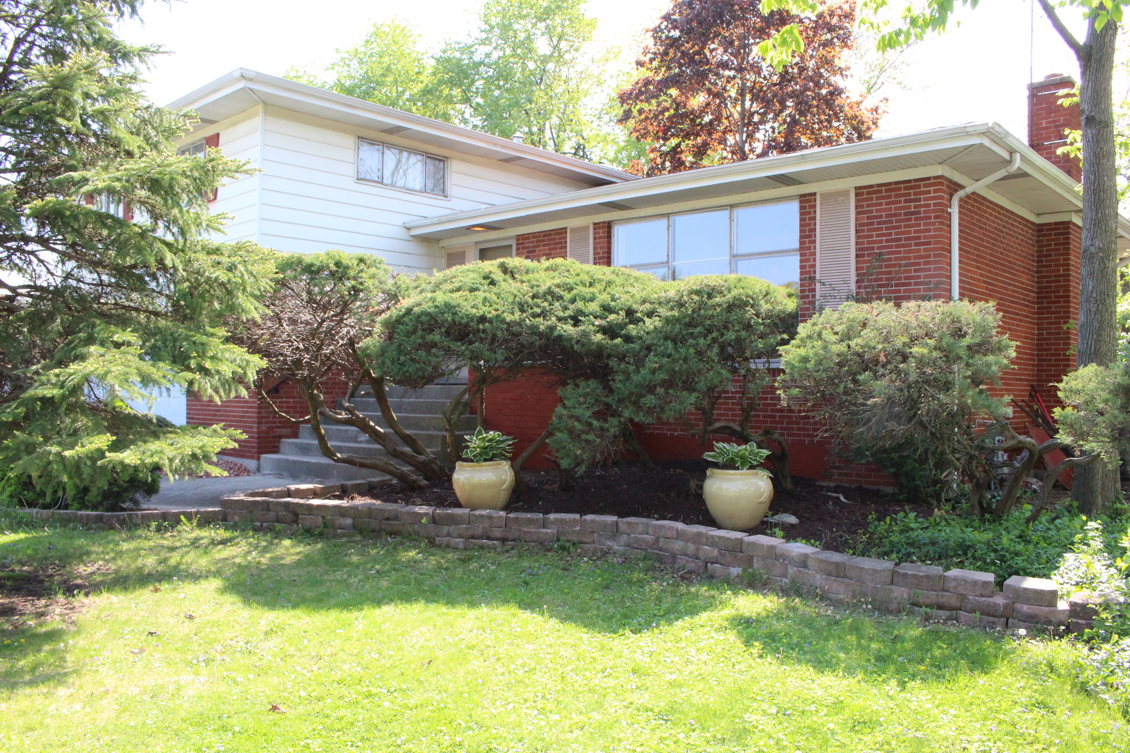 Undisclosed Address Elmhurst, IL 60126 - Photo 4 of 42 a view of a backyard with plants and a patio