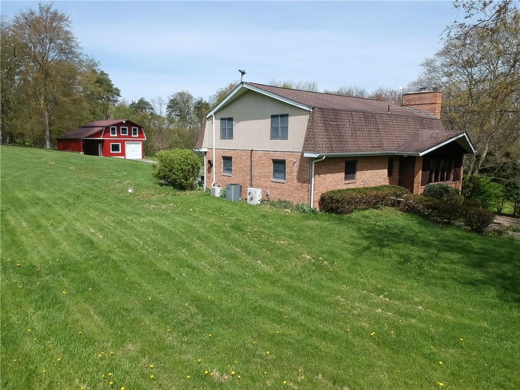 161 B Morgan Road Butler, PA 16002 - Photo 1 of 25 a view of a house with a big yard plants and large trees