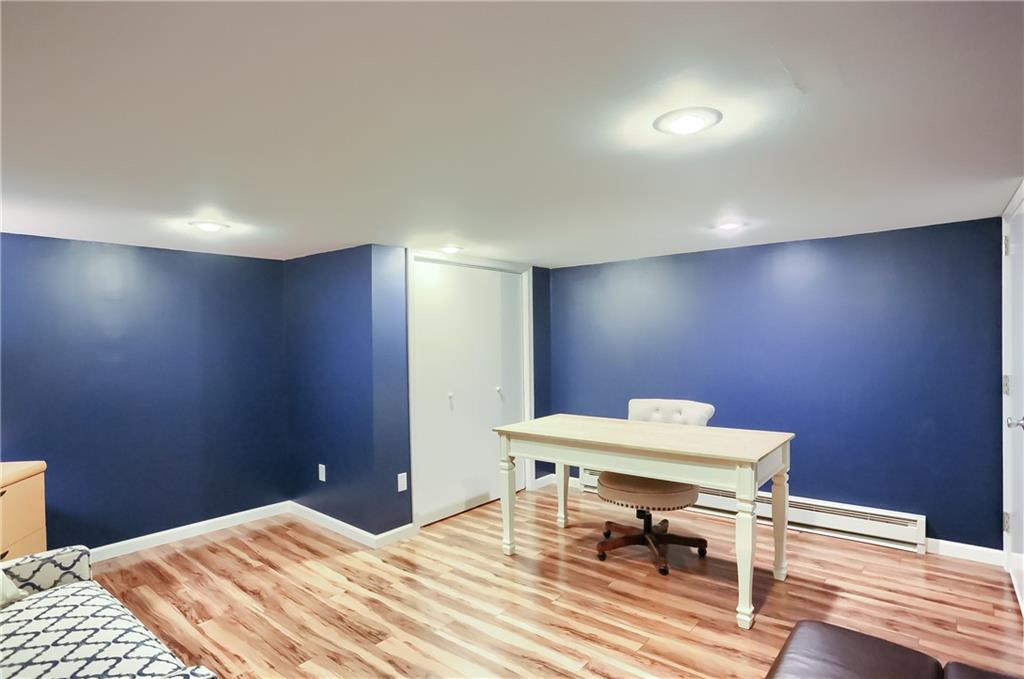 161 B Morgan Road Butler, PA 16002 - Photo 13 of 25 a workspace with furniture wall paintings and a wooden floor