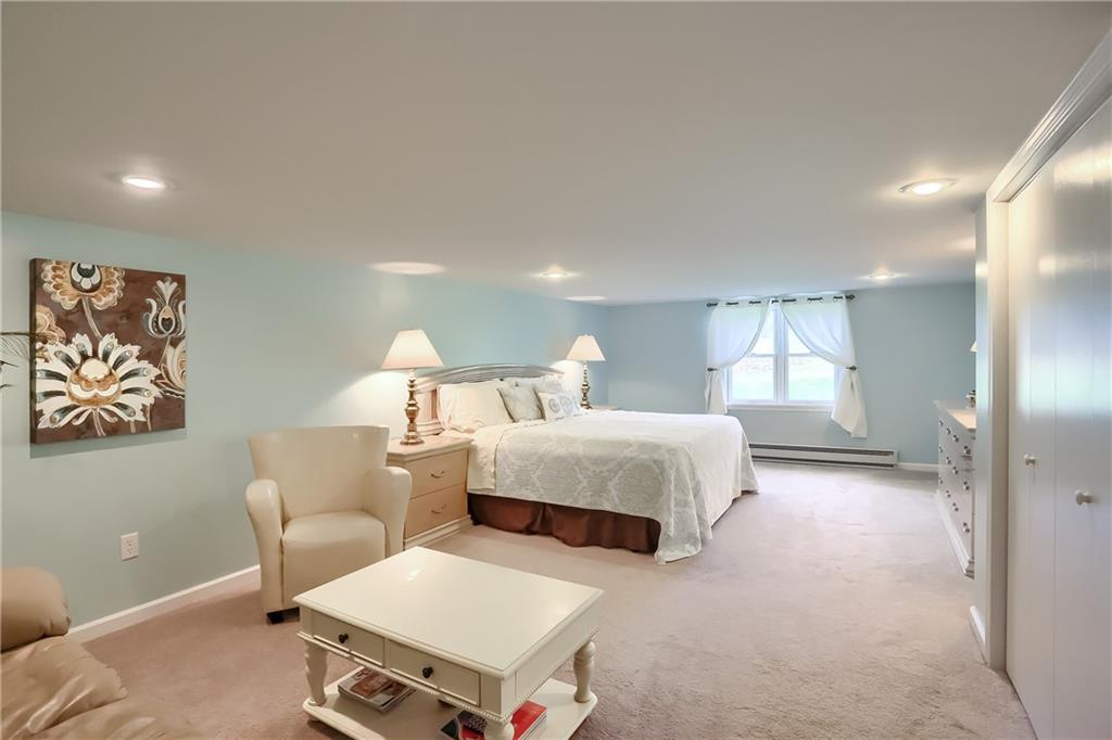 161 B Morgan Road Butler, PA 16002 - Photo 14 of 25 a spacious bedroom with a bed and furniture
