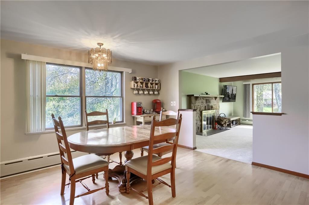 161 B Morgan Road Butler, PA 16002 - Photo 5 of 25 a view of a dining room and livingroom with furniture wooden floor a chandelier