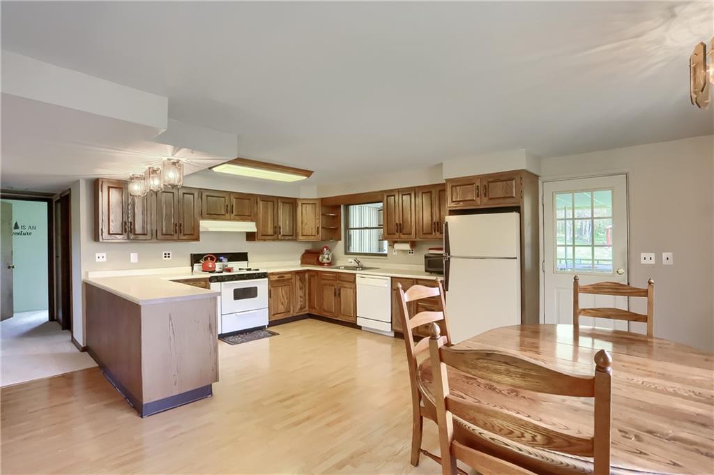 161 B Morgan Road Butler, PA 16002 - Photo 6 of 25 a large kitchen with cabinets wooden floor and stainless steel appliances