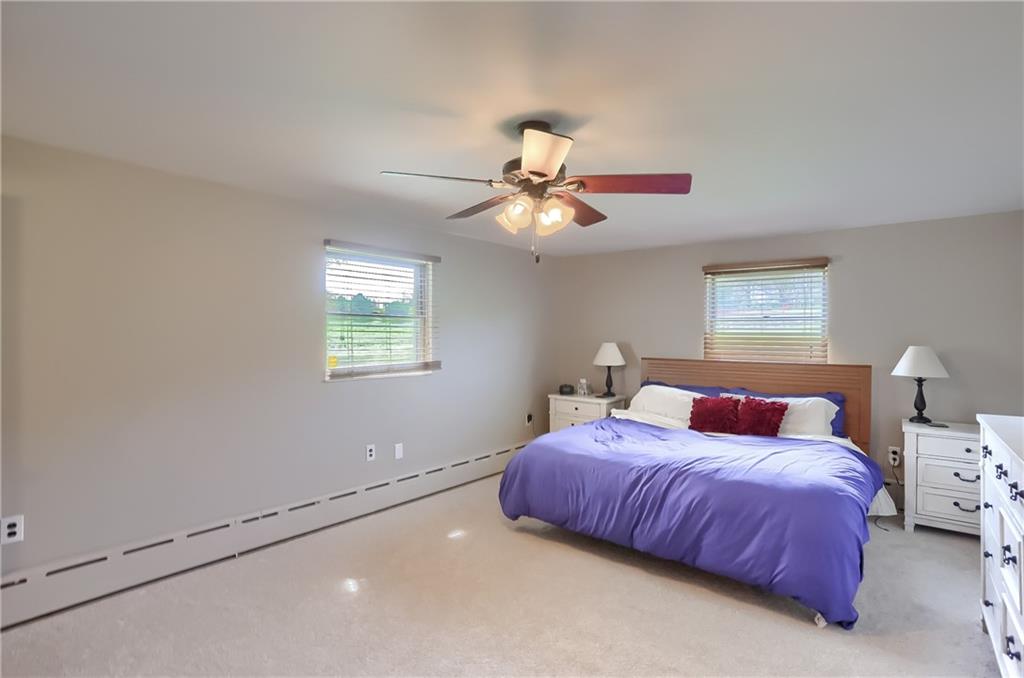 161 B Morgan Road Butler, PA 16002 - Photo 7 of 25 a bedroom with a bed and a chandelier