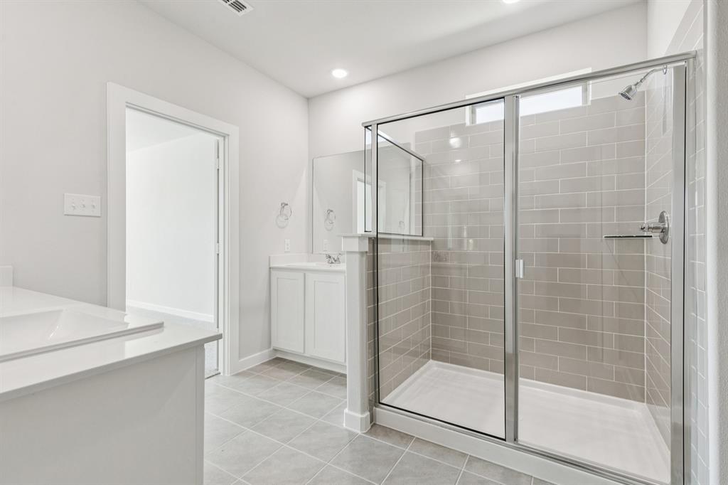 2105 Sunshining Road Princeton, TX 75407 - Photo 17 of 37 a bathroom with a shower and a sink