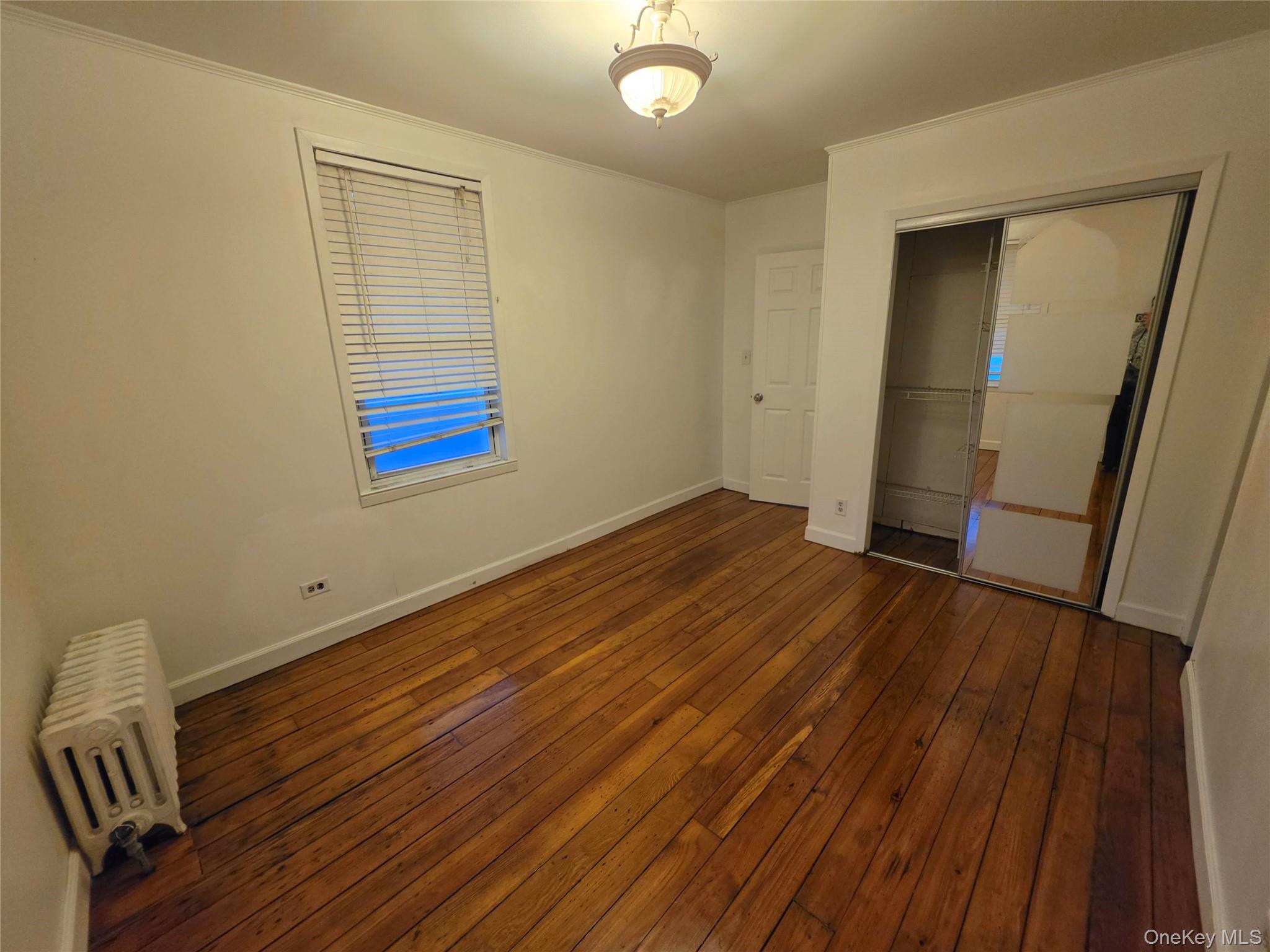 60 Main Street Tappan, NY 10983 - Photo 11 of 22 a view of empty room with wooden floor and fan